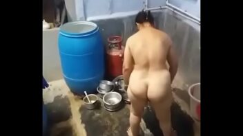 Indian Girl Bathing In Open